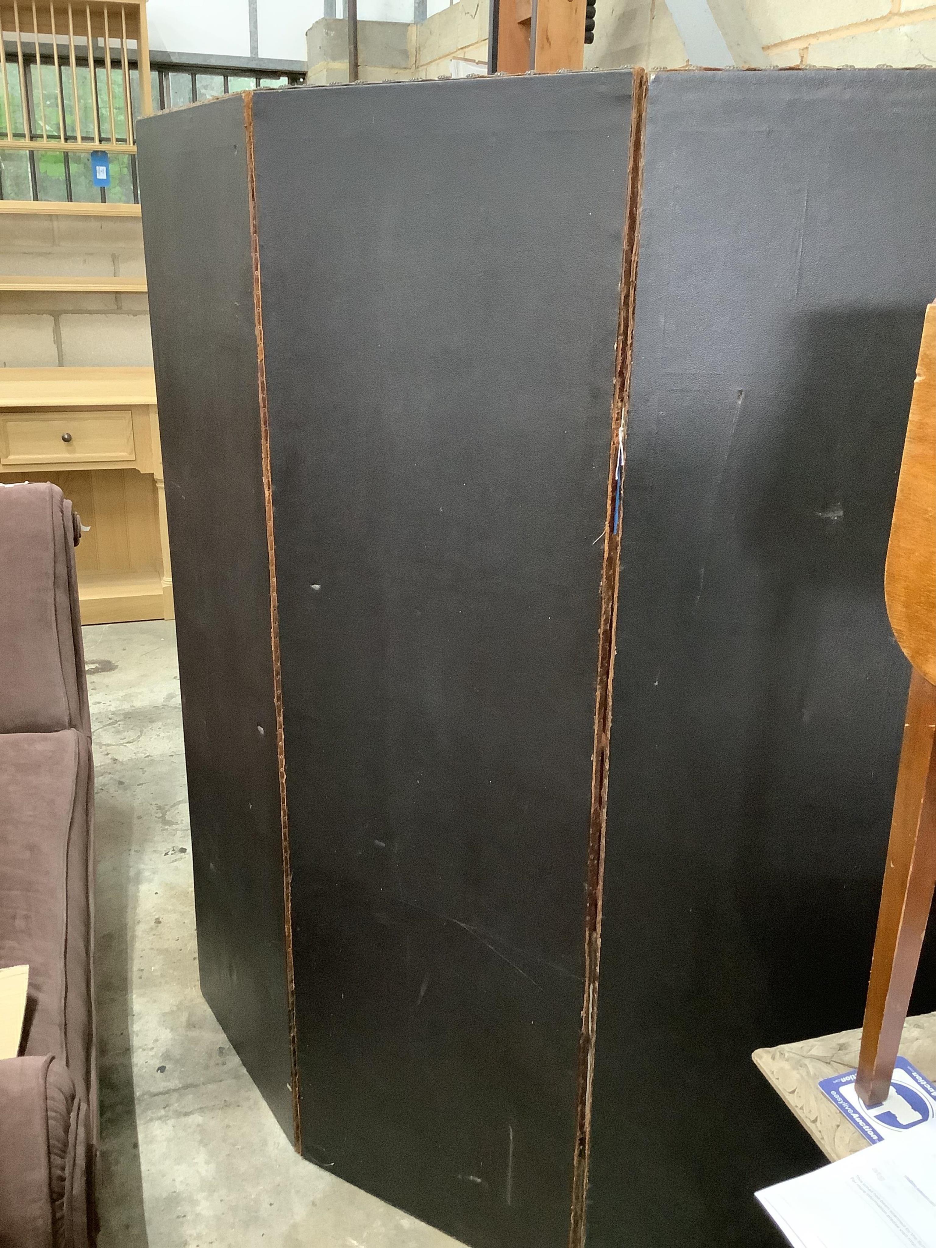 An embossed leather three fold dressing screen, each panel width 50cm, height 166cm. Condition - fair